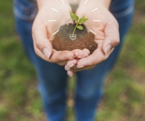 close-up-woman-holding-soil-with-plant